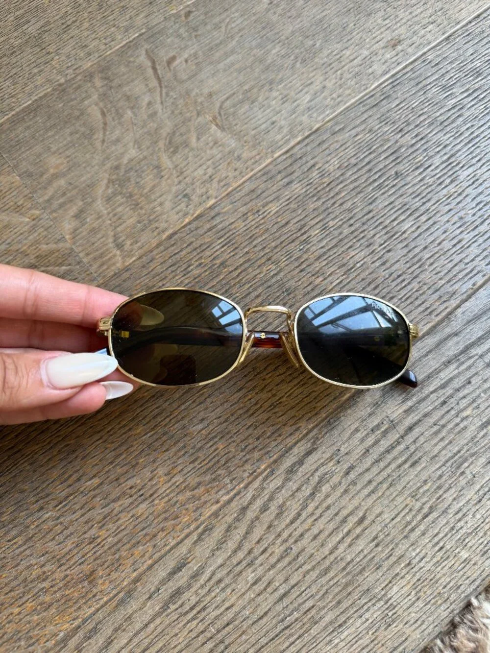 Prada PR oval sunglasses in gold with brown lenses